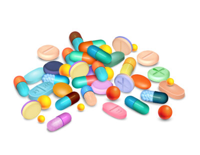 Colored pills and granules medical realistic composition on white vector illustration